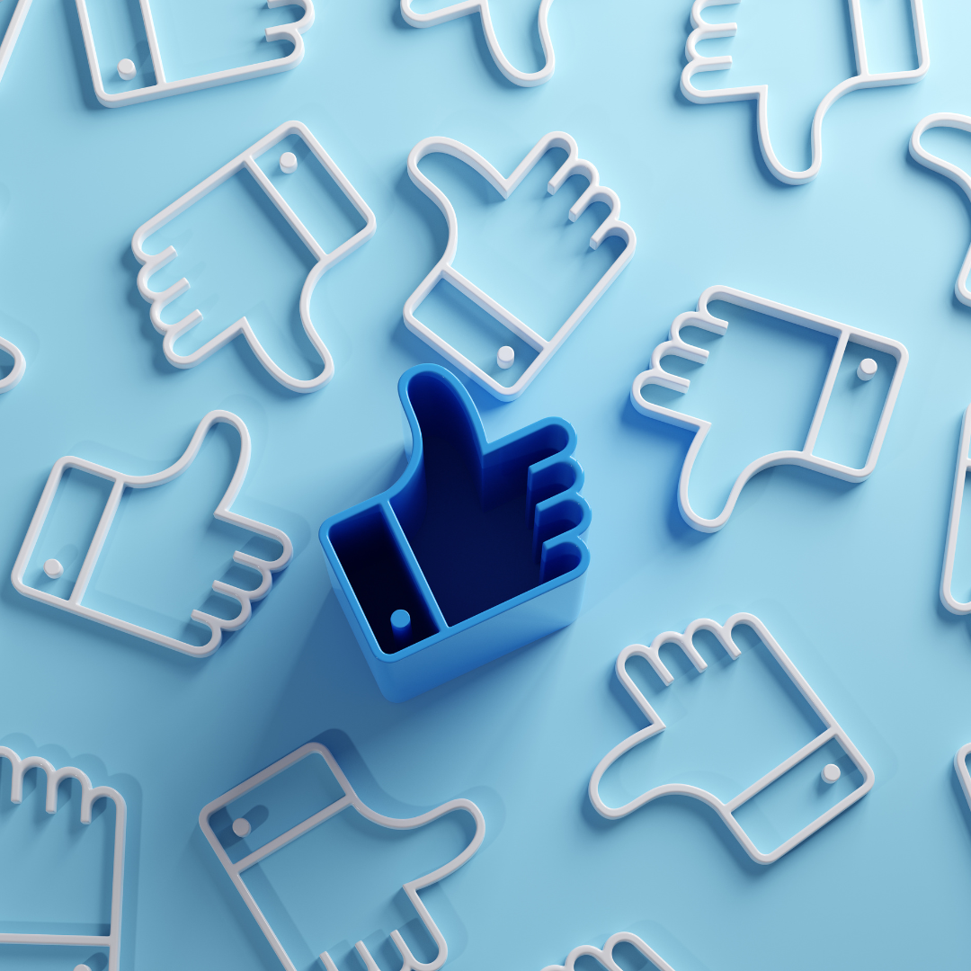 Pattern of 3D thumbs-up and thumbs-down symbols in soft blue tones, with one solid blue thumbs-up icon standing out among the outlines.