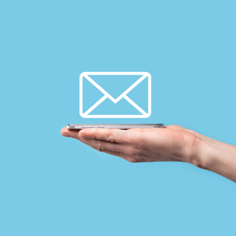 A hand holding a smartphone with a white envelope icon floating above it, set against a bright blue background, symbolising email communication or digital messaging.