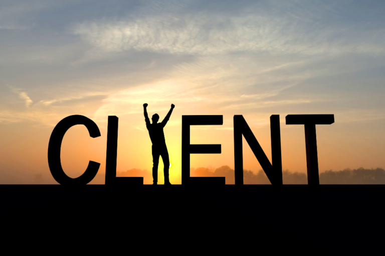 A silhouette of a person standing victoriously with arms raised inside large bold letters spelling 'CLIENT,' set against a warm sunrise or sunset background, symbolising client success and achievement.